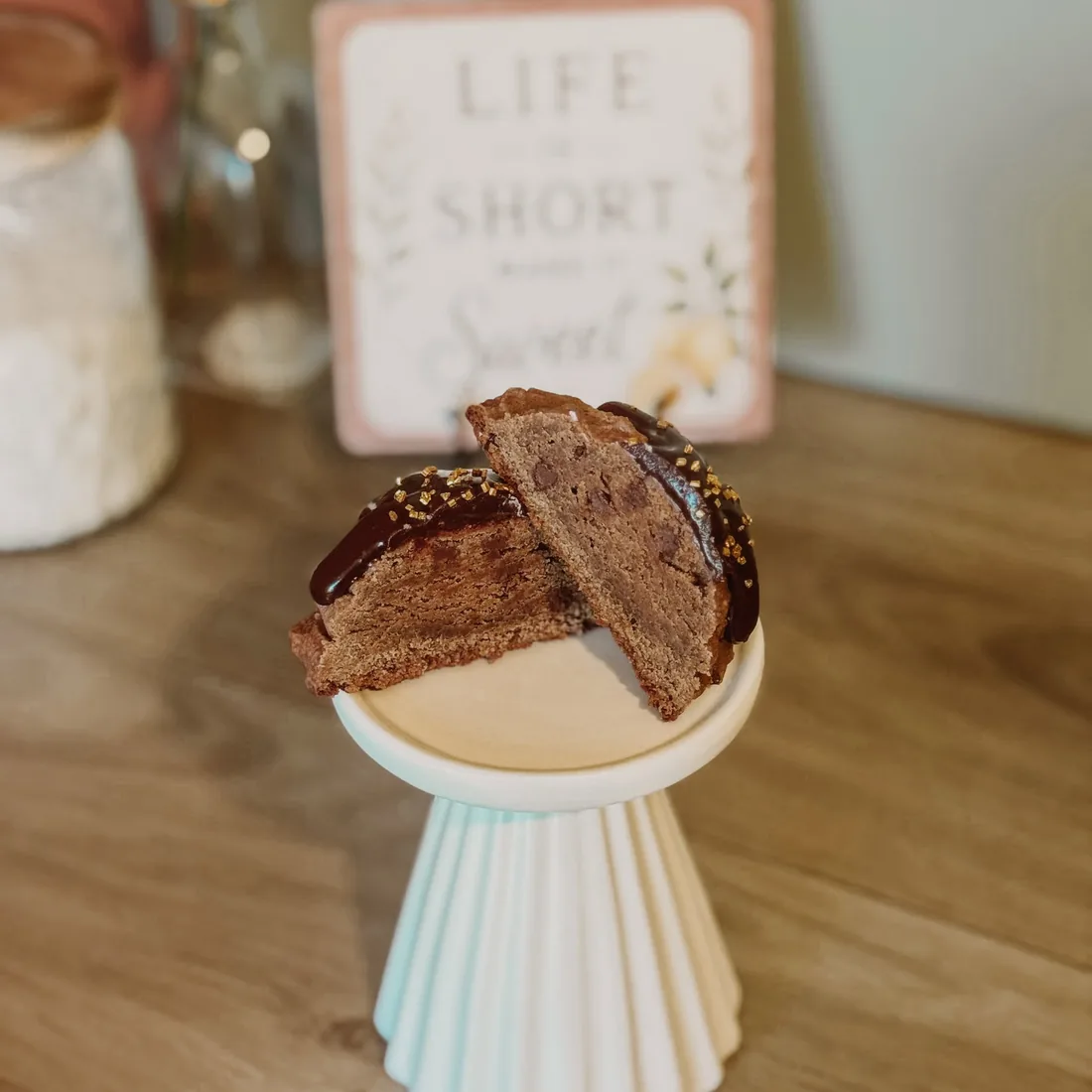 Chocolate cookie split open to show the chocolate filling inside